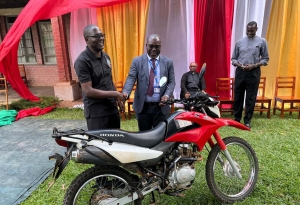 Centenary Bank Masaka Branch, hands over a donation of a motorcycle